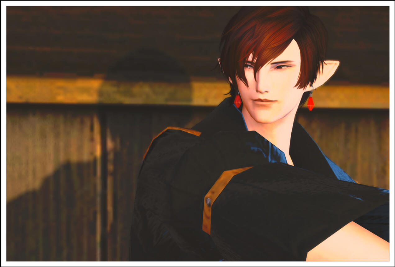 Remont, smiling mildly, and looking to the left.